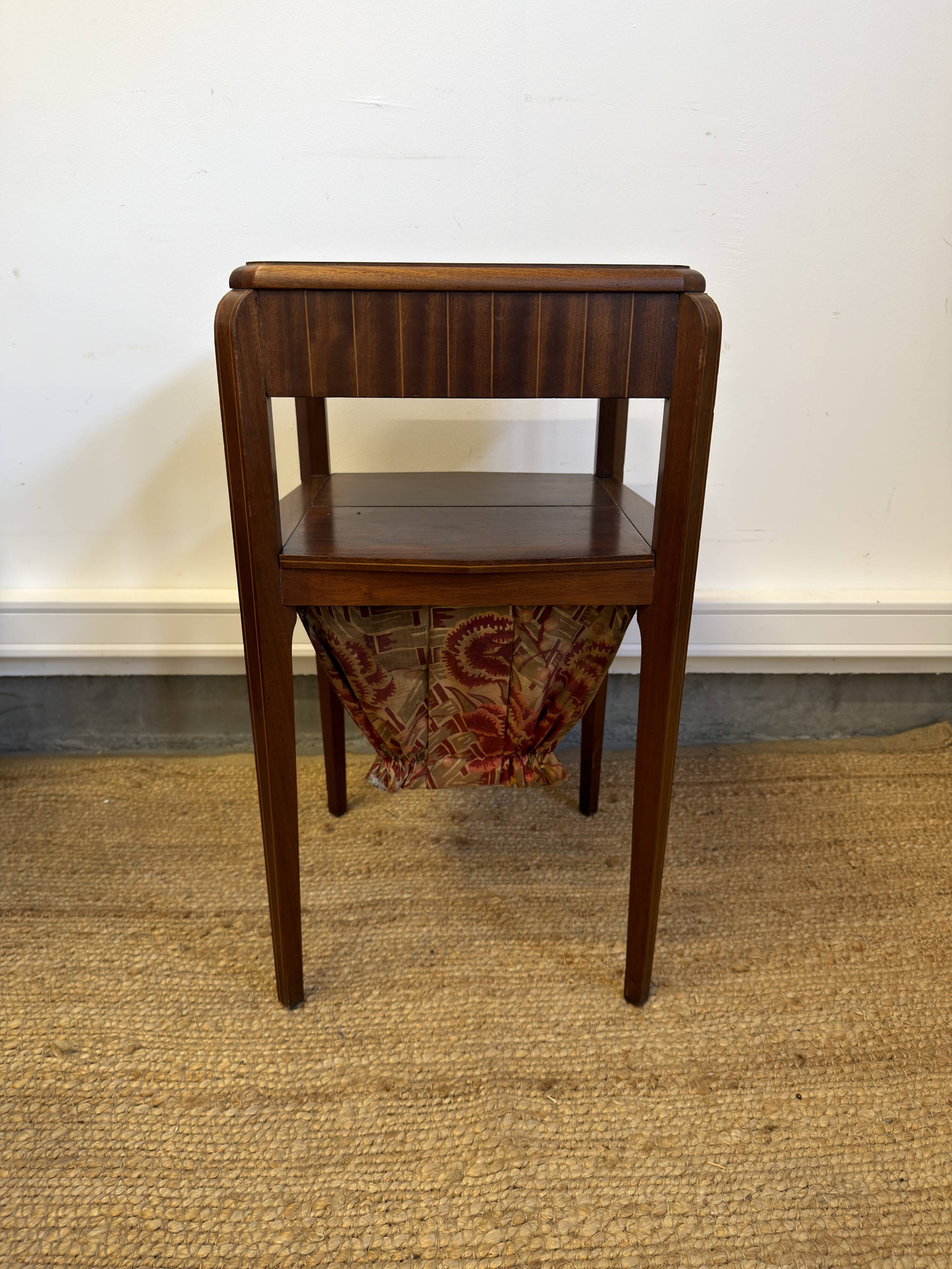 Art Deco sewing table in walnut with a foldable shelf.