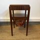 Art Deco sewing table in walnut with a foldable shelf.