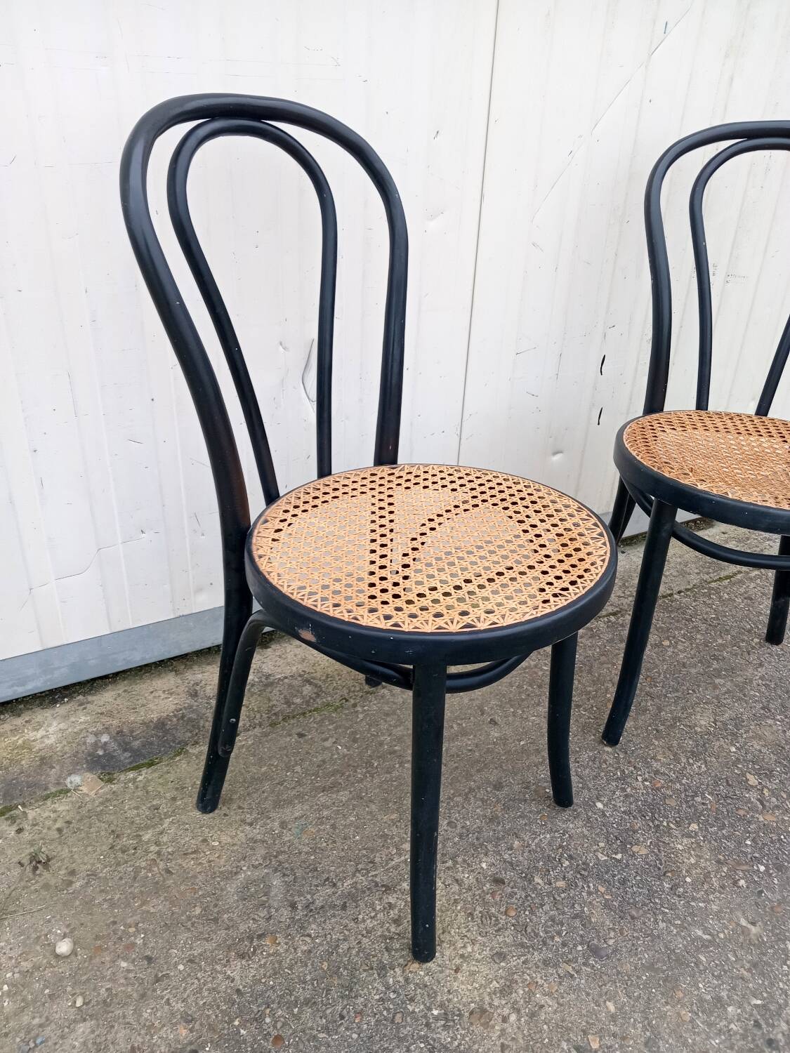 Pair of fmg bentwood and cane bistro chairs