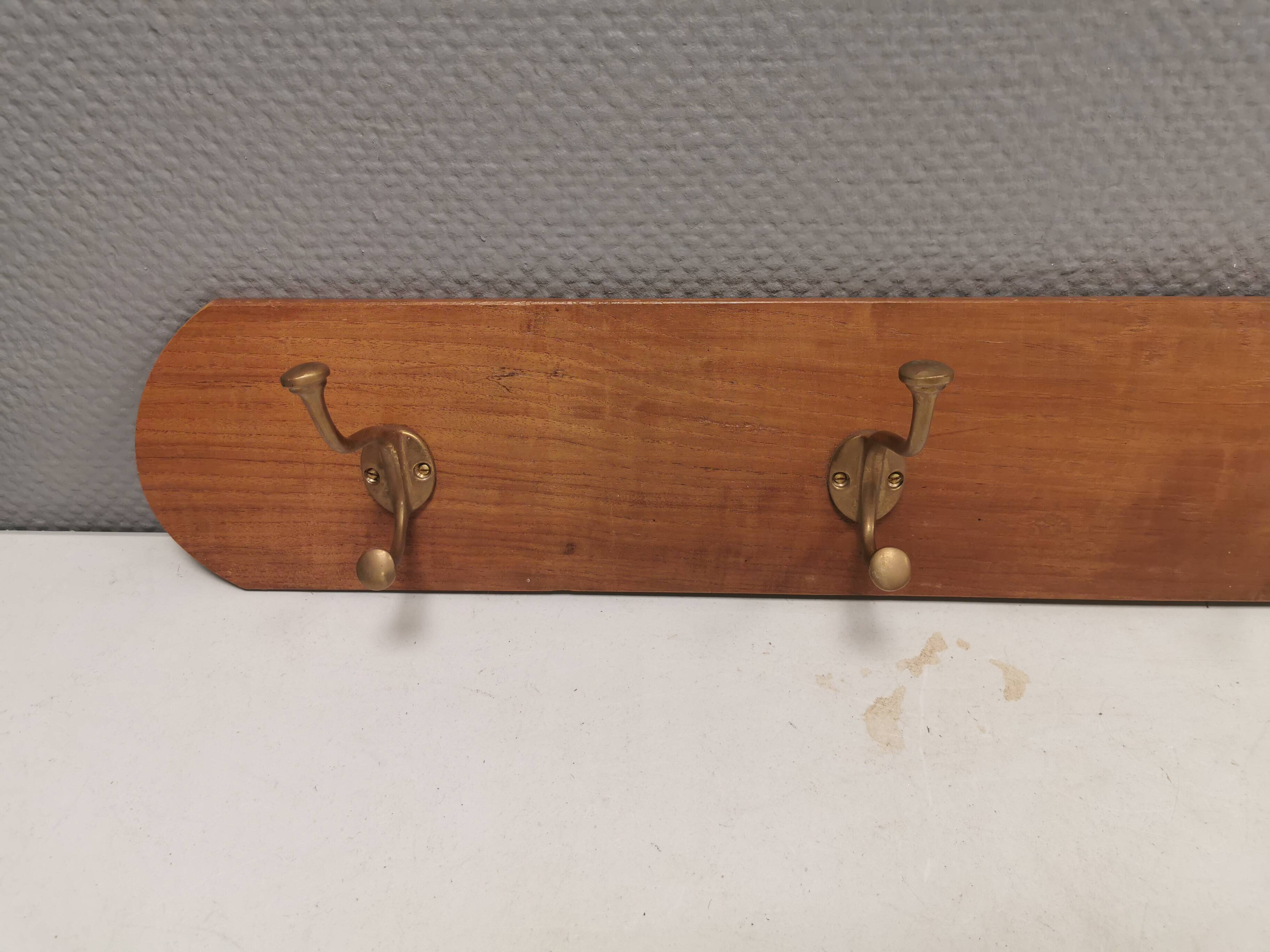 Coat rack in teak and brass. Denmark 1970-80s