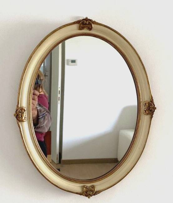 Mirror in wood and stucco with gilded highlights 20th century