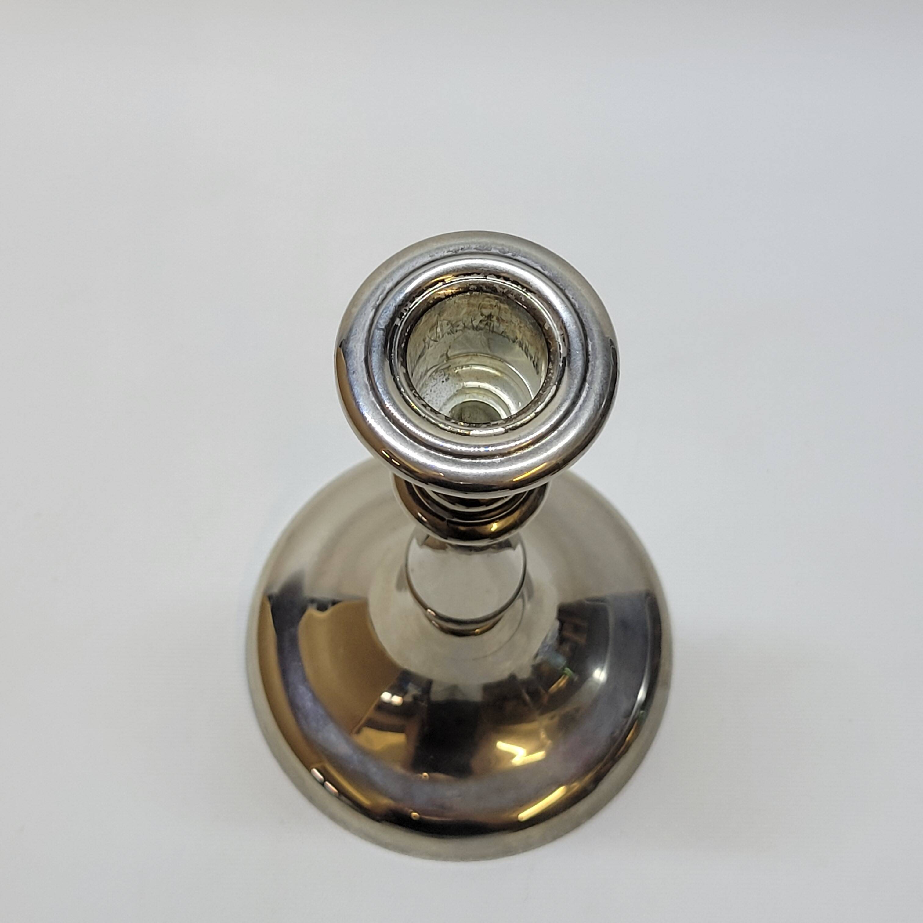 Old candle holder in silver metal