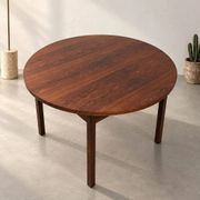 Extendable round rosewood dining table