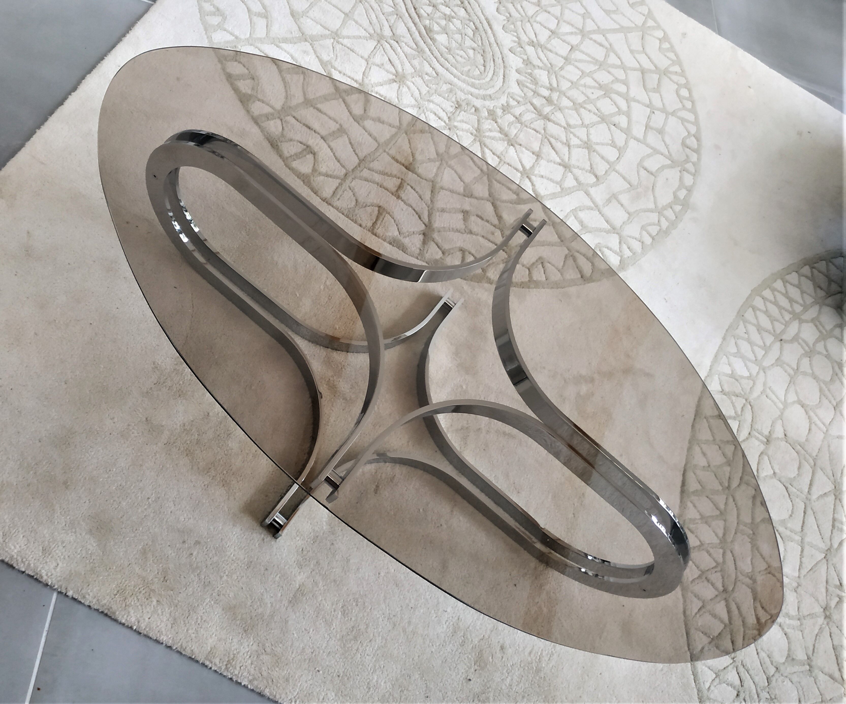 Chrome metal coffee table and oval smoked glass tray