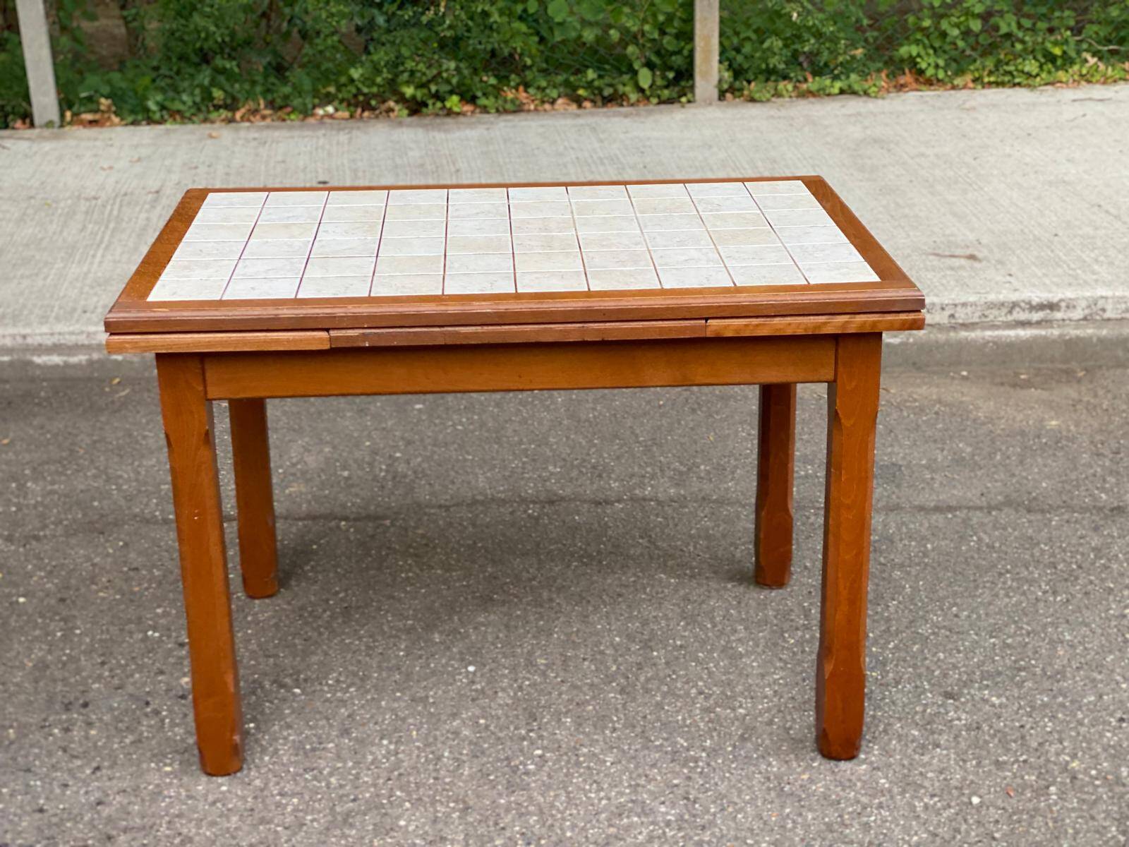 Dining table or farmhouse kitchen style with solid wood and tiles.