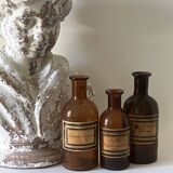 3 amber apothecary bottles