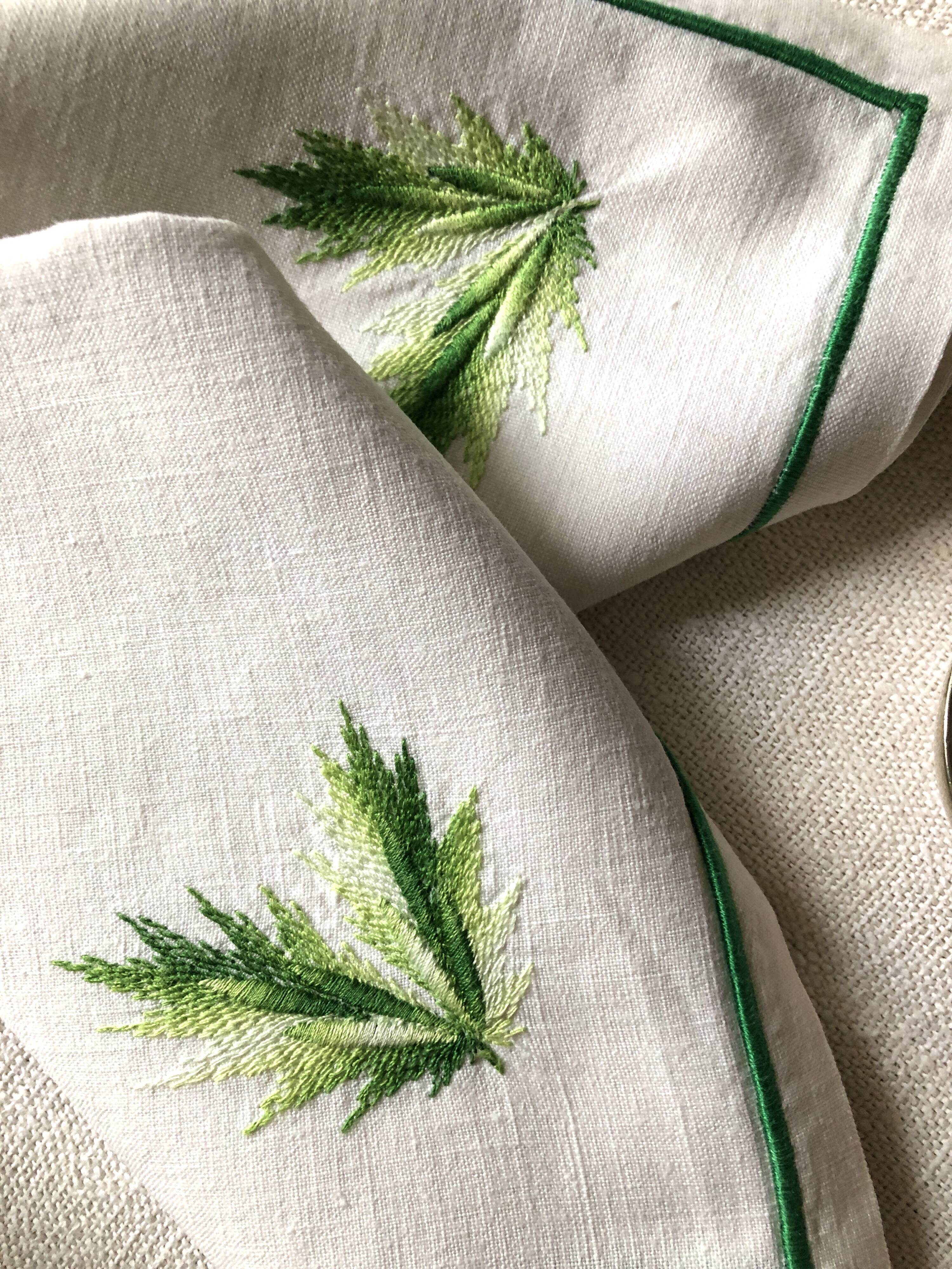 Series of four embroidered linen napkins