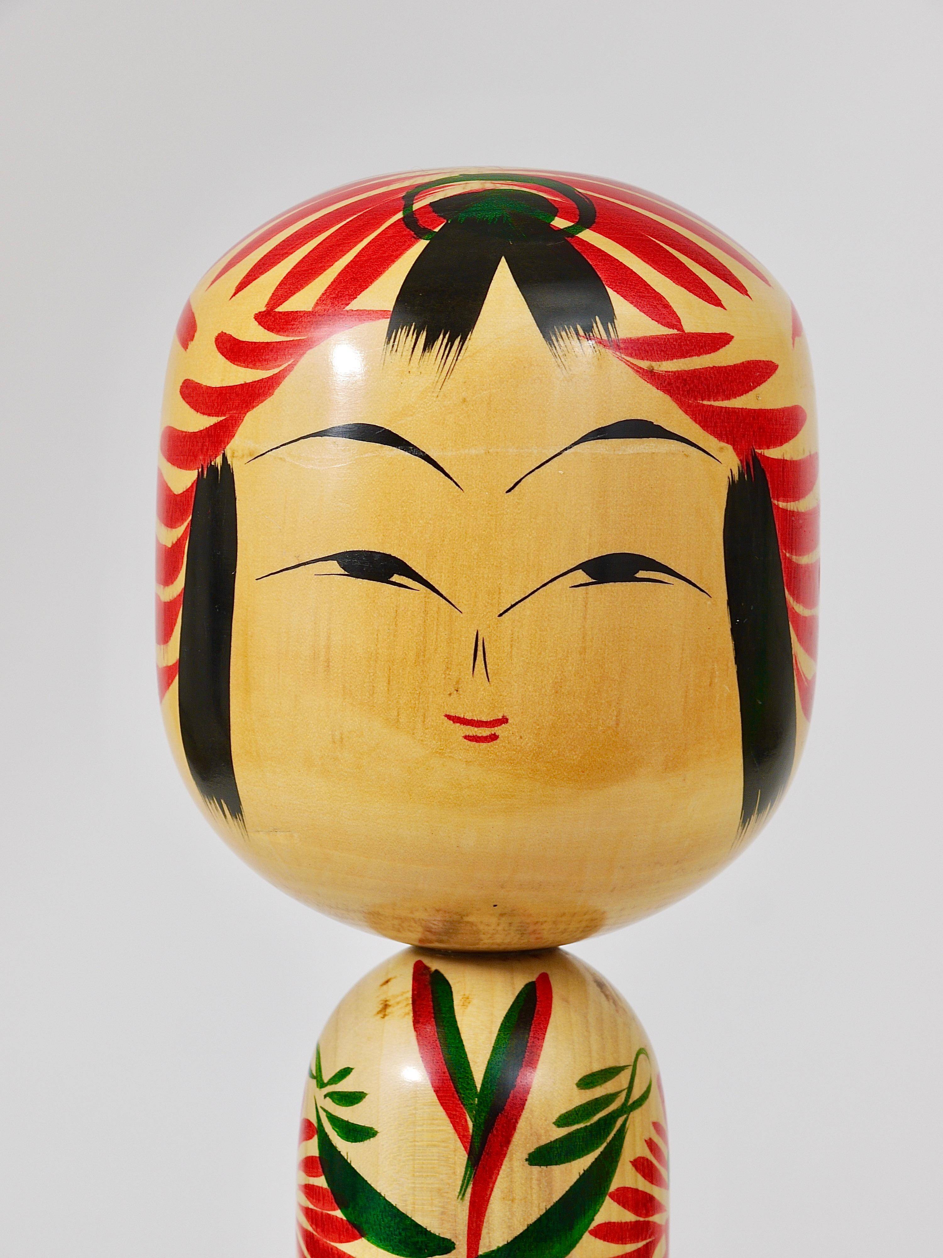Decorative Kokeshi doll sculpture from northern Japan, hand-painted, signed.