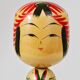 Decorative Kokeshi doll sculpture from northern Japan, hand-painted, signed.