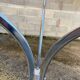 Table with chrome metal legs and smoked glass top.