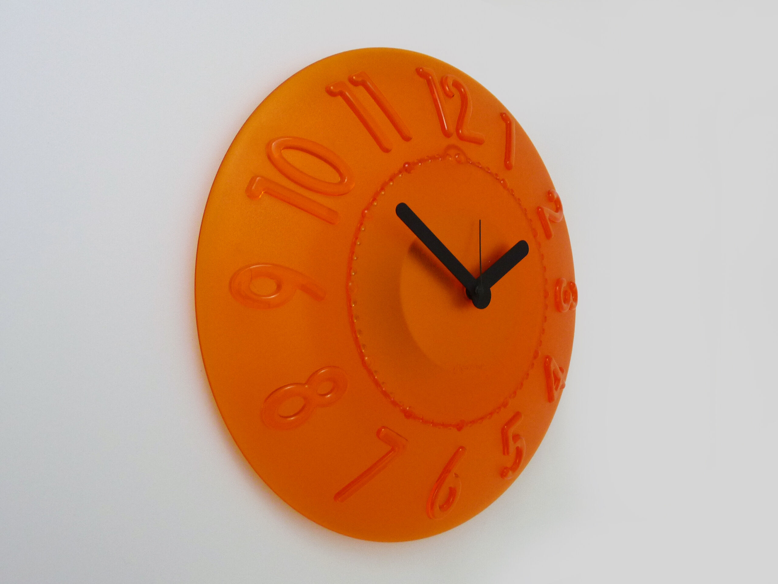 Guzzini orange wall clock from the 1980s