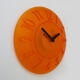 Guzzini orange wall clock from the 1980s