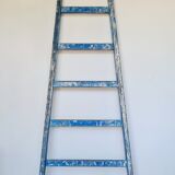 Old ladder in blue wood