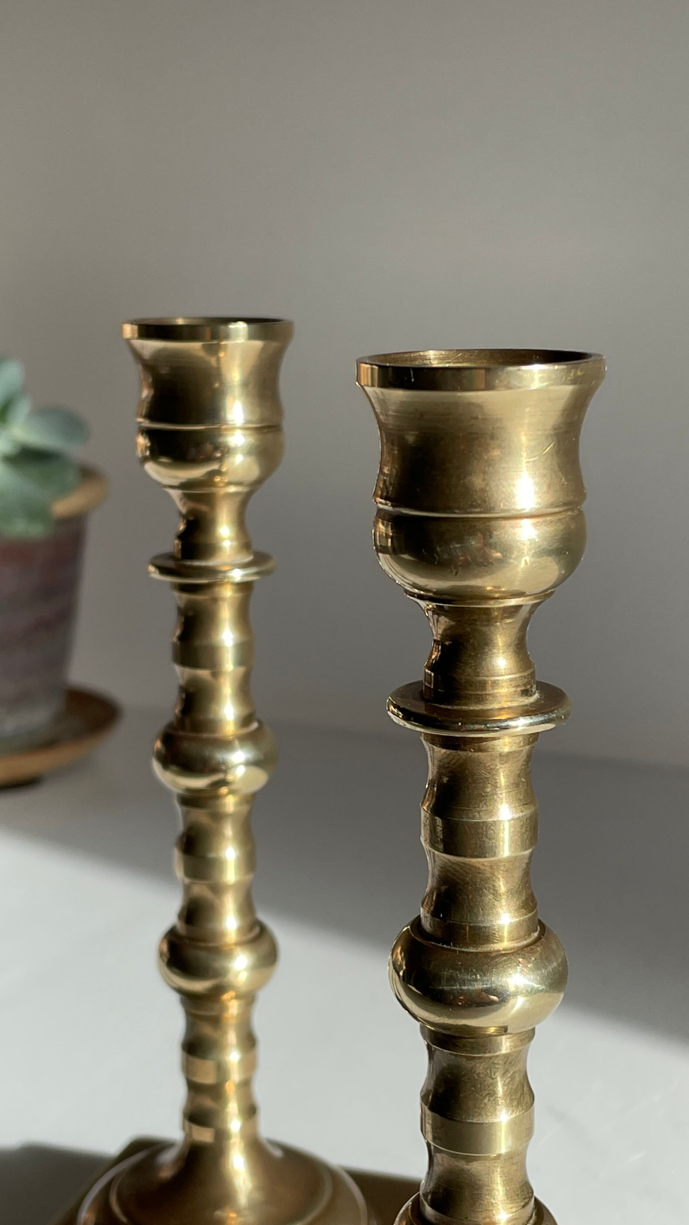 Pair of brass candle holders made in England