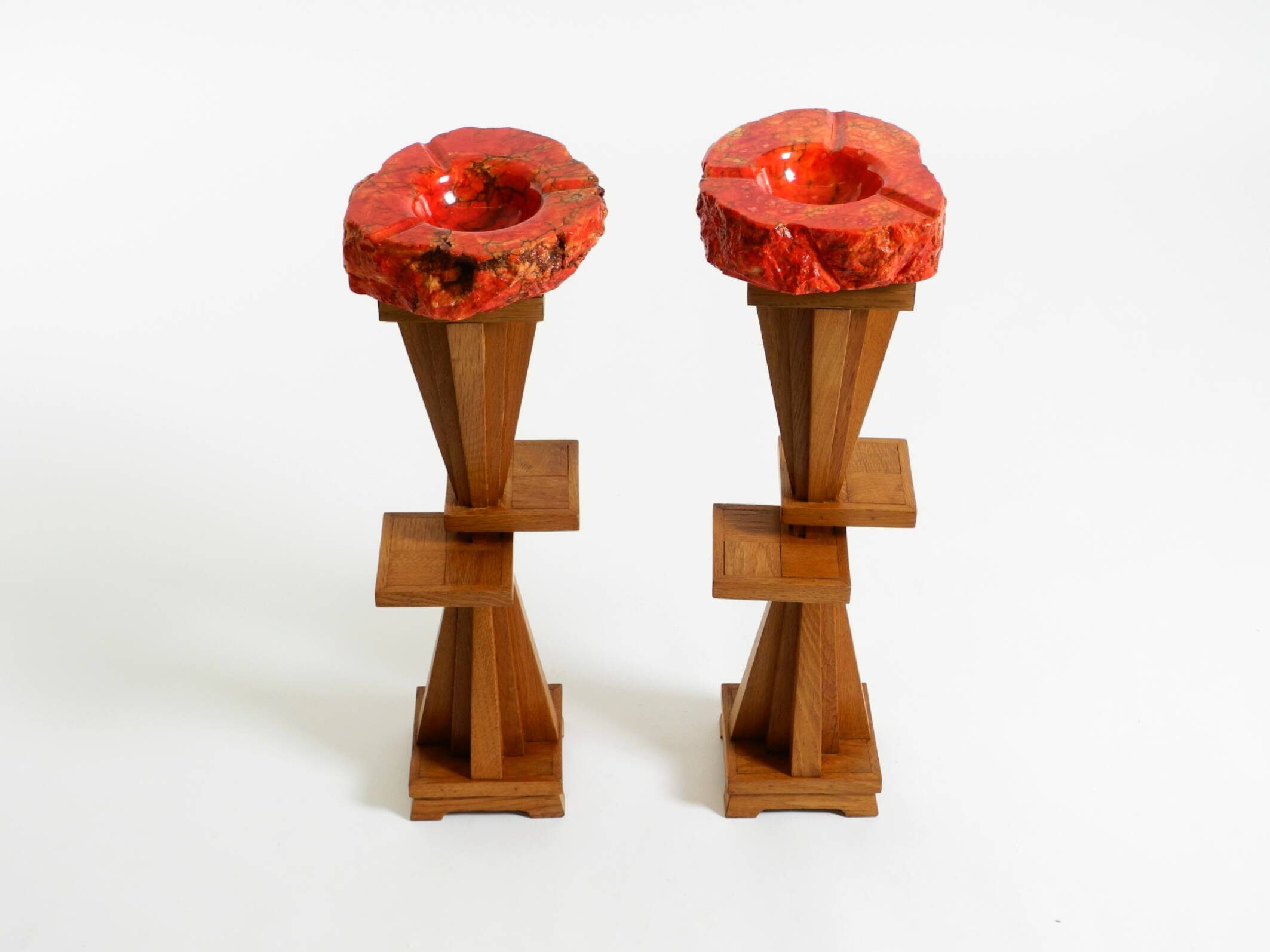 Two mid-century standing ashtrays consisting of red Alabaster cup