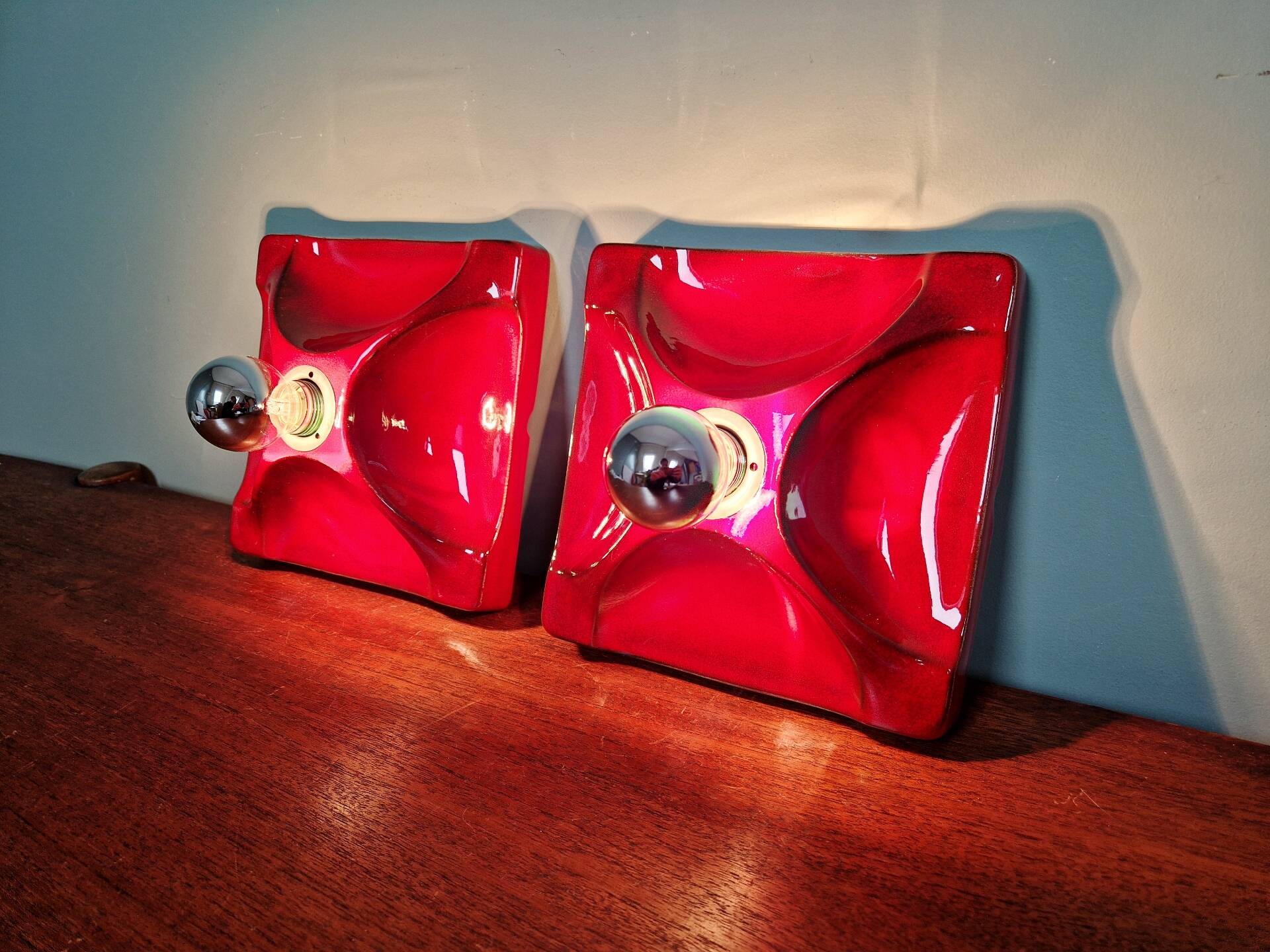 Pair of Space Age wall sconces in red ceramic, 1970.