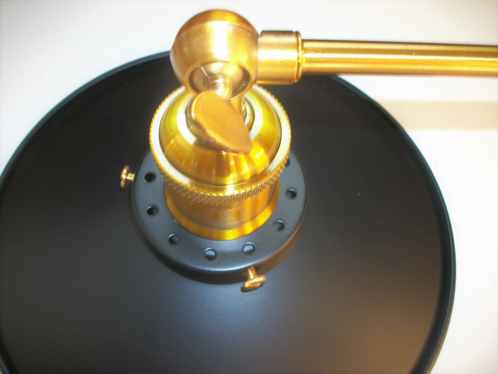 Pair of metal wall lamps in black and bronze color