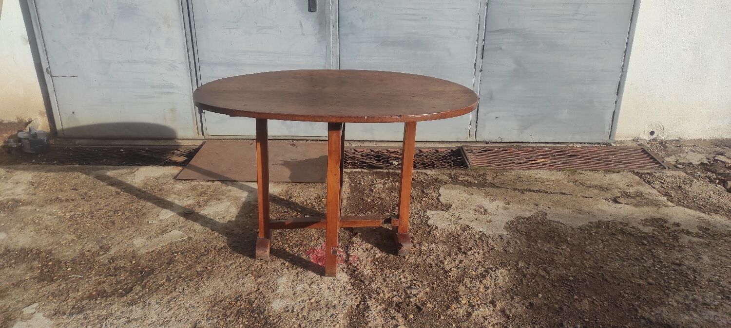 Old rustic oval folding wooden farmhouse table