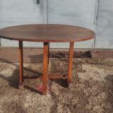 Old rustic oval folding wooden farmhouse table