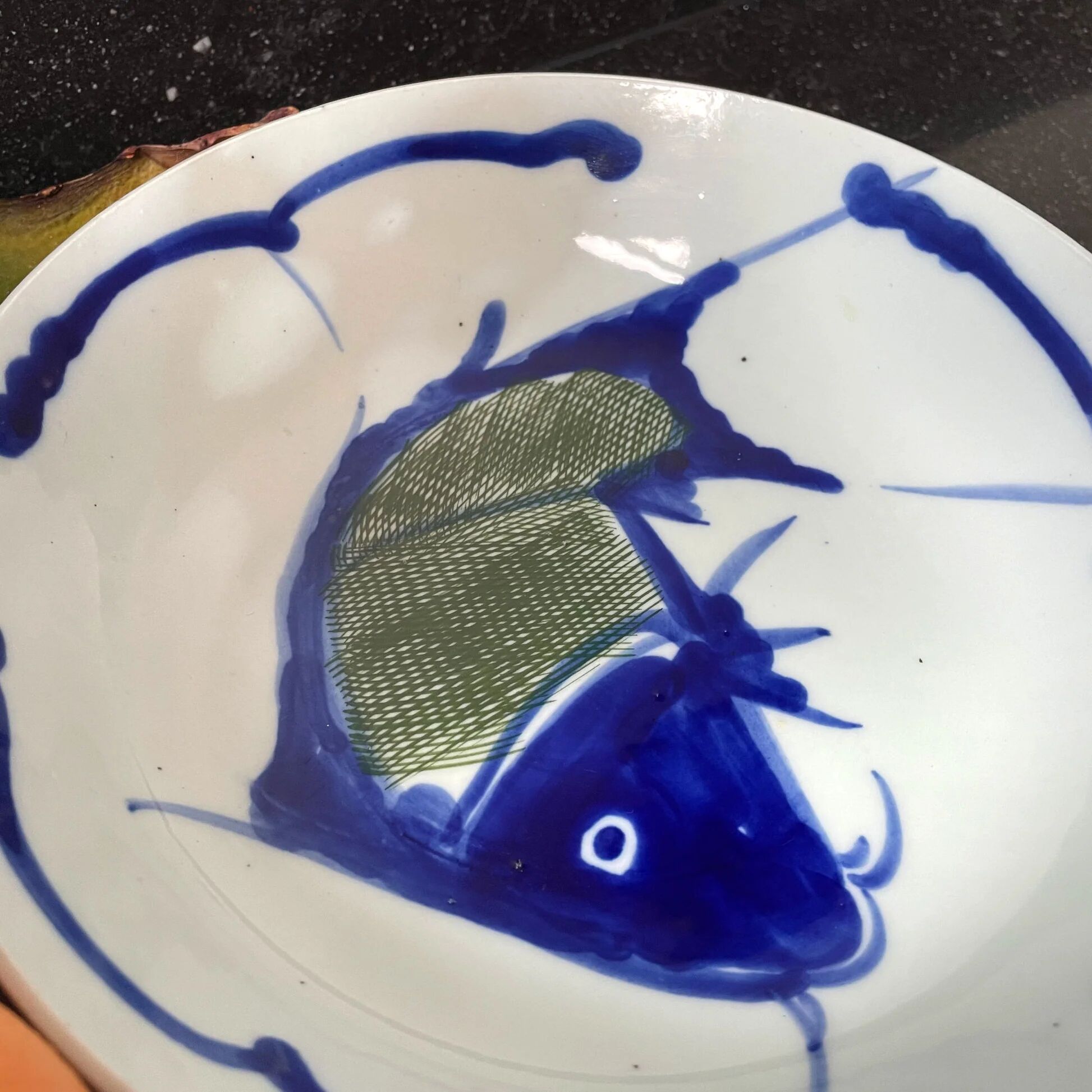Hand-painted Chinese porcelain bowl with blue fish