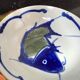 Hand-painted Chinese porcelain bowl with blue fish