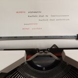 Olympia Alphamatic typewriter with Notice