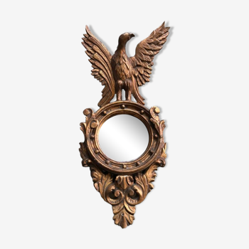 Miroir en bois doré Empire à décor d’aigle 40x97cm