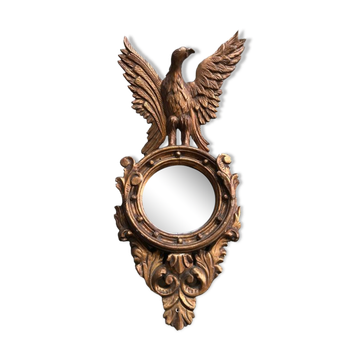 Miroir en bois doré Empire à décor d’aigle 40x97cm
