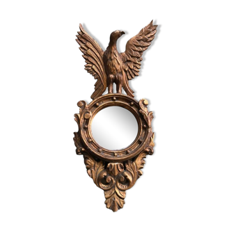 Miroir en bois doré Empire à décor d’aigle 40x97cm