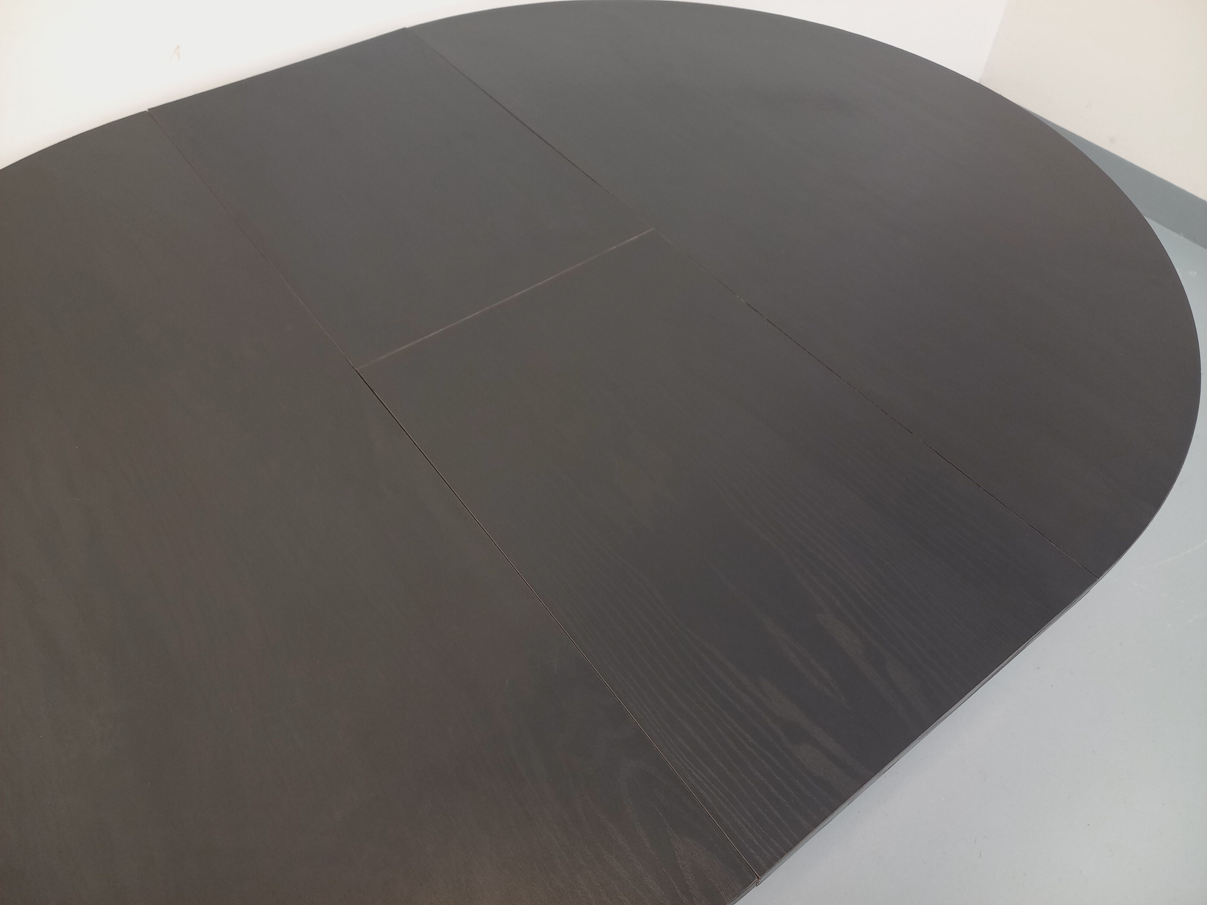 Vintage dining table in melamine with a black wood effect and chrome metal.