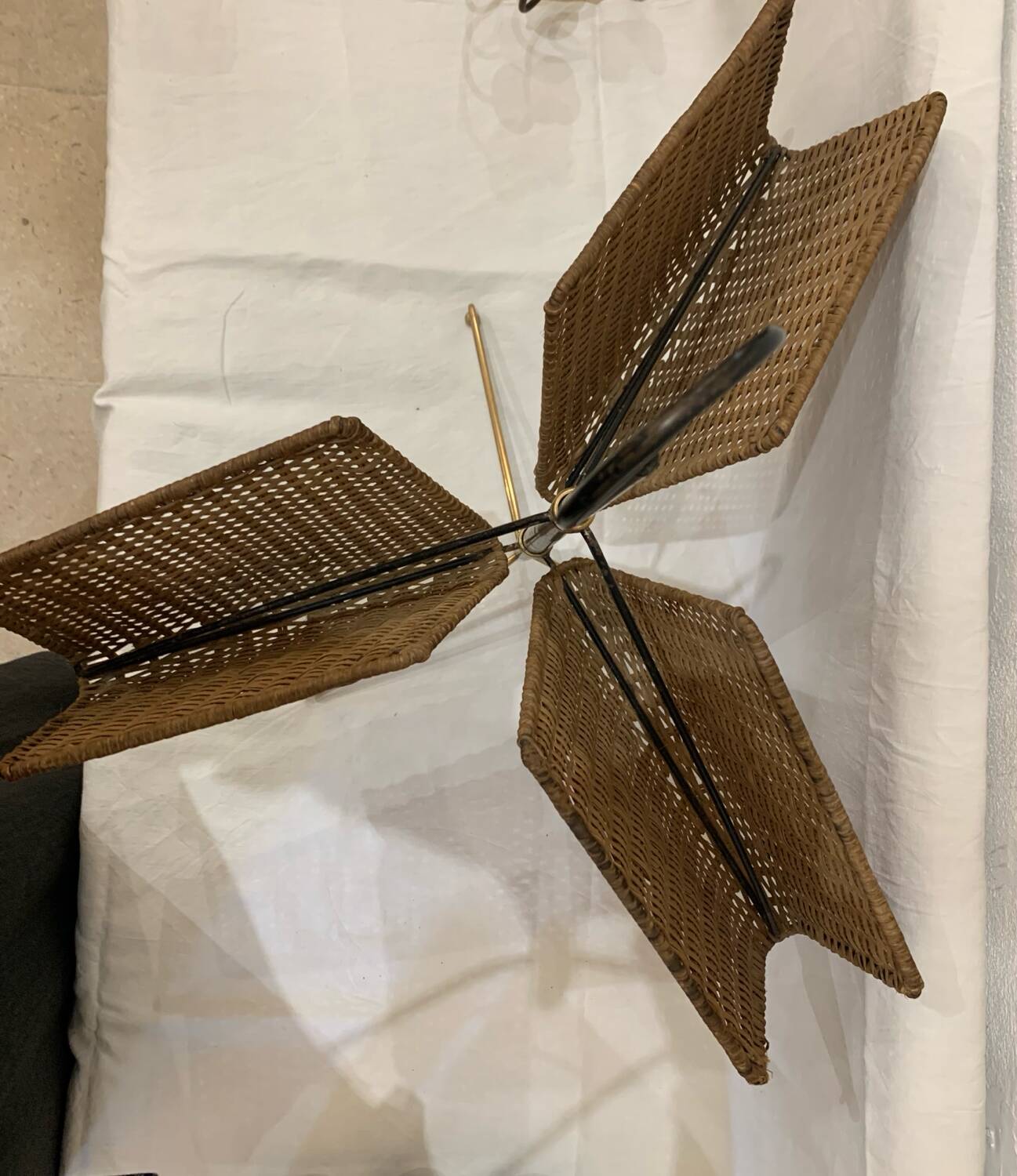 Wicker, iron, and brass magazine rack