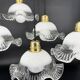 Set of 5 scalloped white opaline flower pendants, braided black cable.