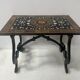 Blackened wood display table with marquetry top, Spain, 19th century.