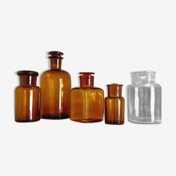 5 apothecary vials in amber and transparent glass