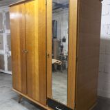 French wardrobe with tapered legs, 3 doors, 1 mirror (27*130), and 1 drawer.