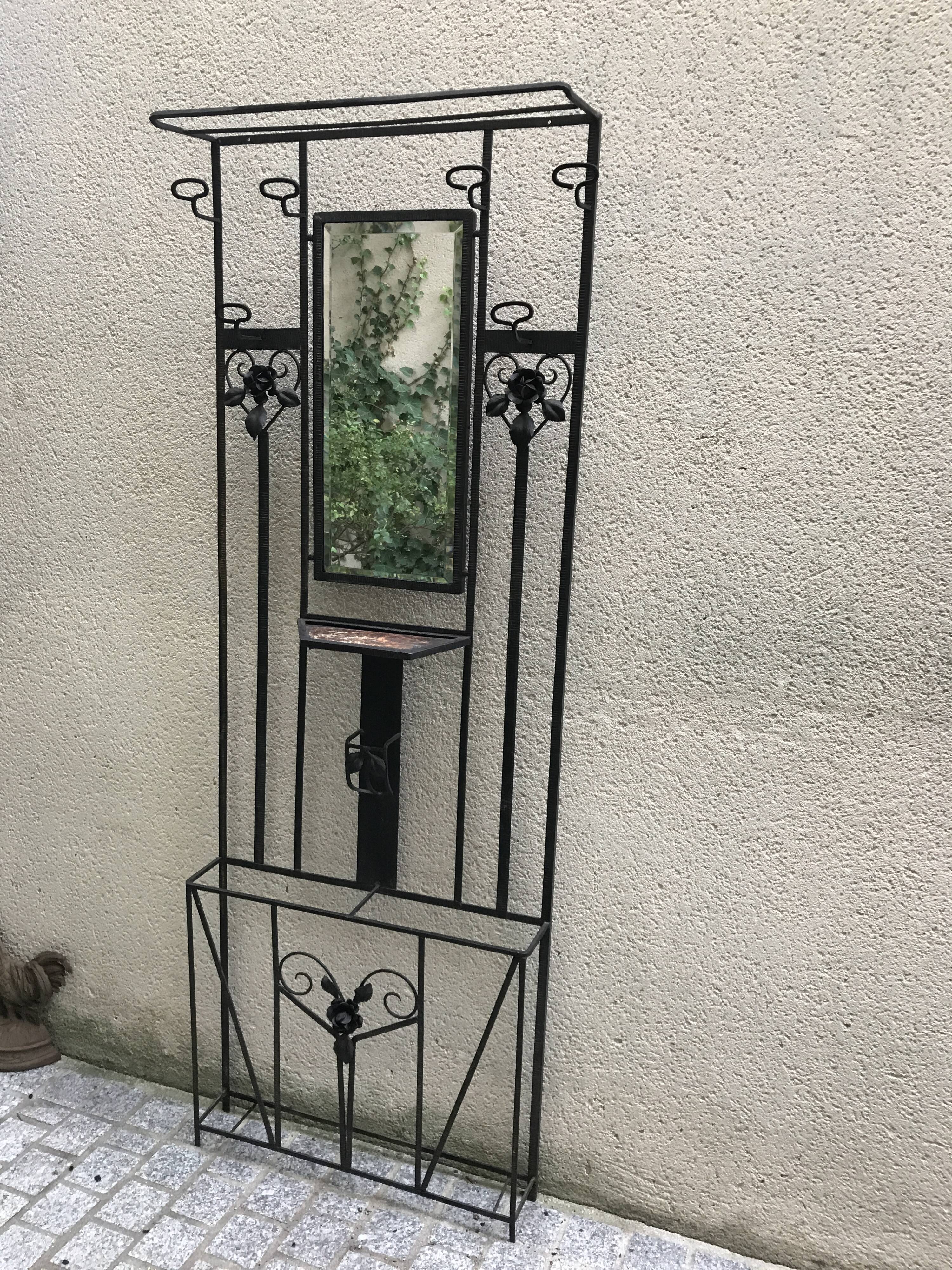 Wrought iron coat holder with 1930