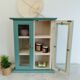 Green and beige 2-door wall display case