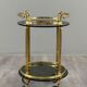 Rolling serving table in gold metal and smoked glass, 20th century