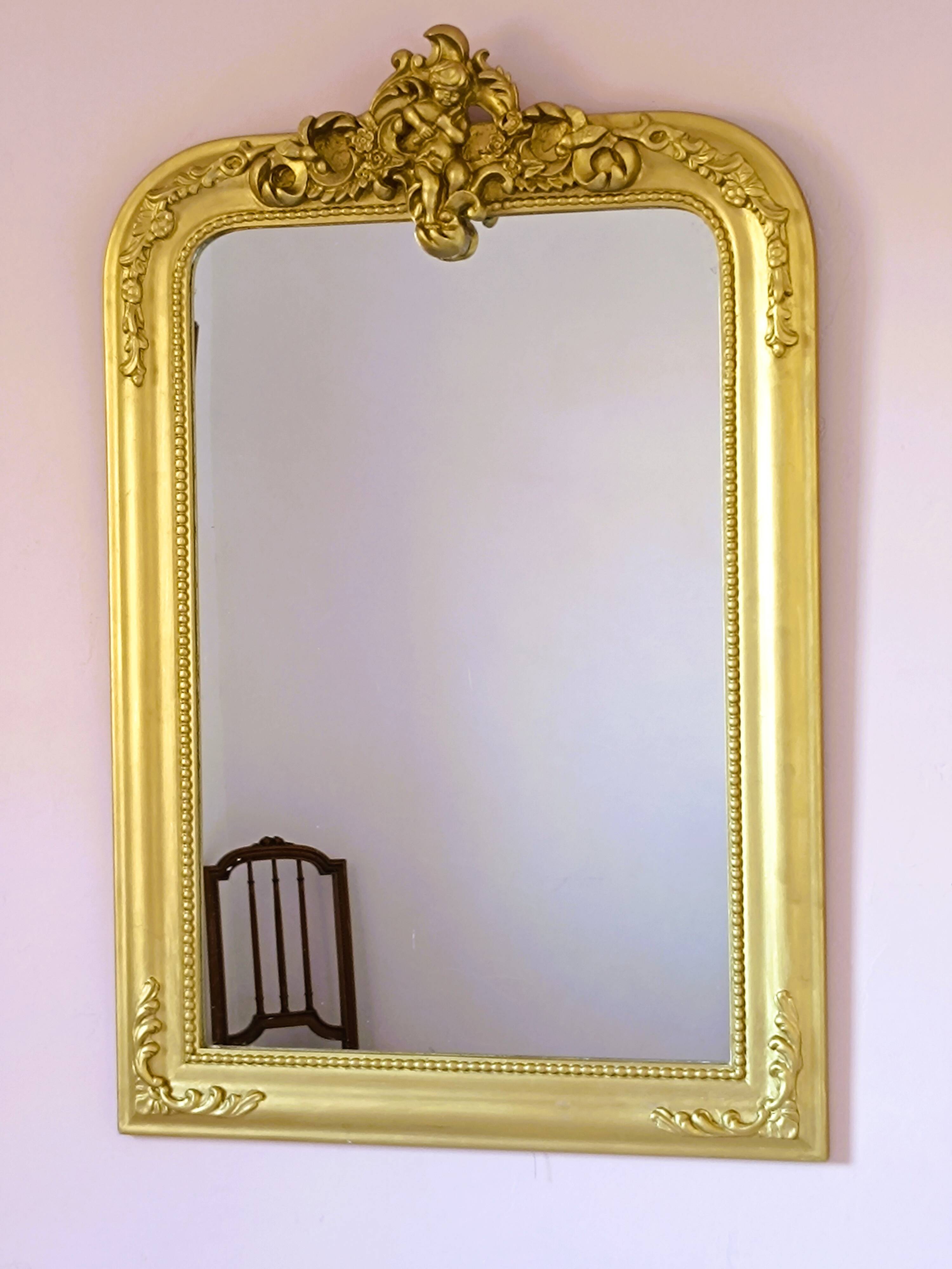 Gilded mirror with a Louis Philippe style pediment