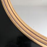 Oval mirror in gilded wood 43x53cm