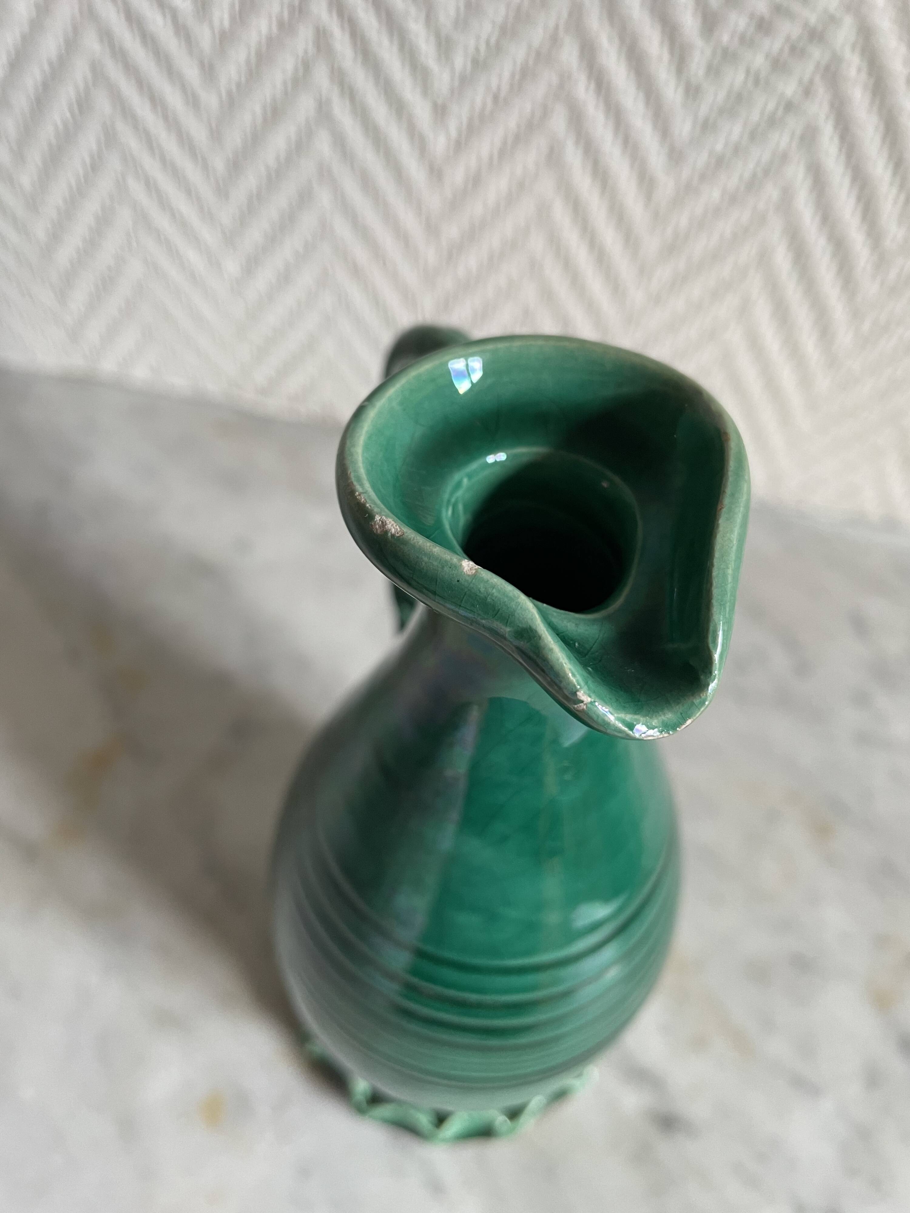 Small green ceramic pitcher