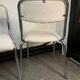 Pair of chrome chairs upholstered in boucle fabric.