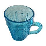 Old turquoise glass cup