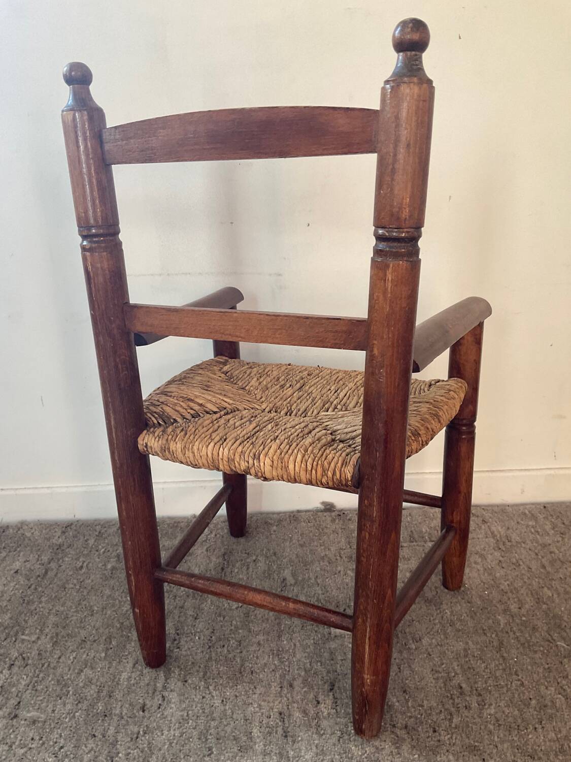 Vintage wooden armchair and straw seat for children