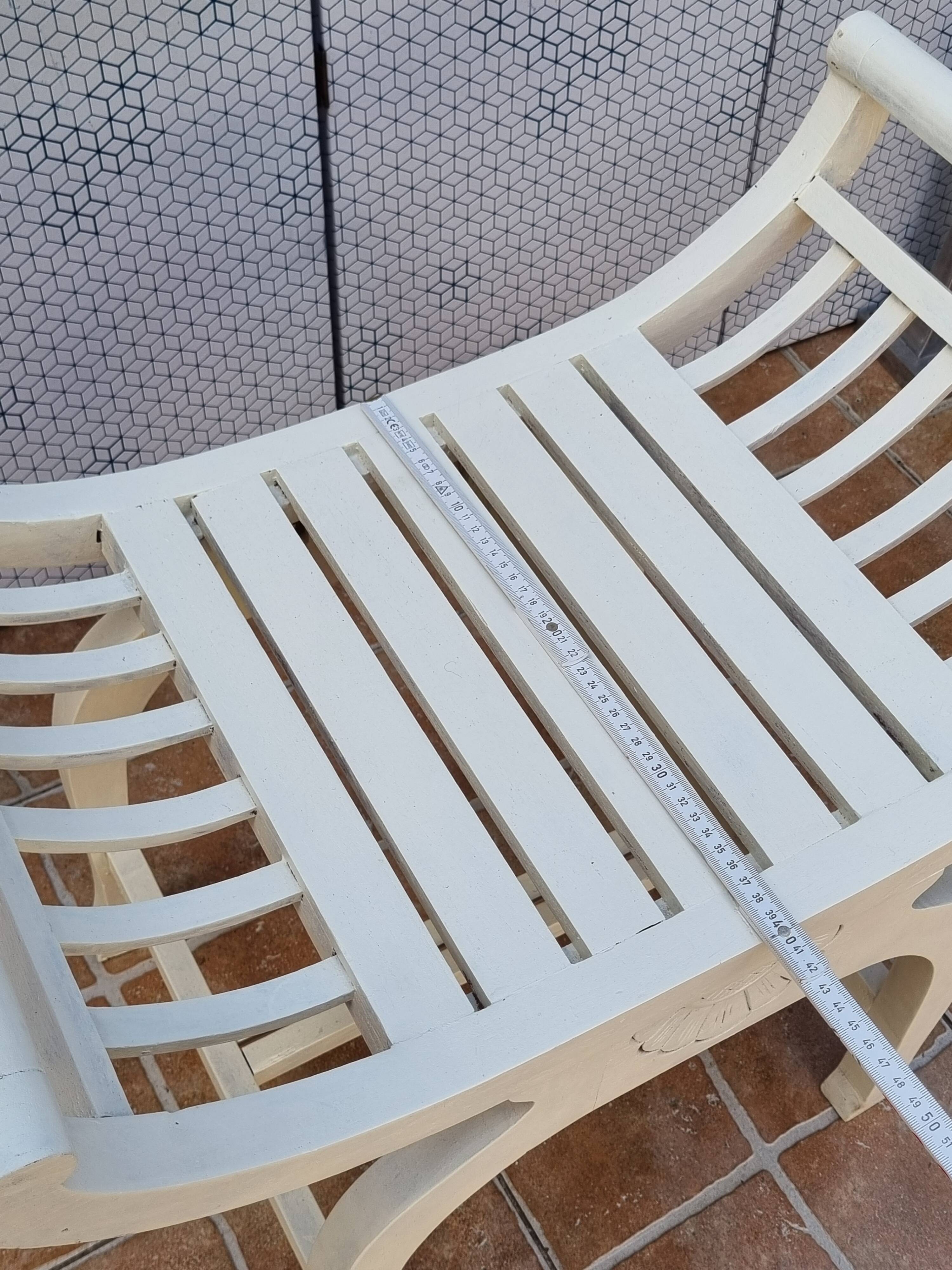 Curule stool in patinated carved wood, Manuel Canovas seat, 60 cm