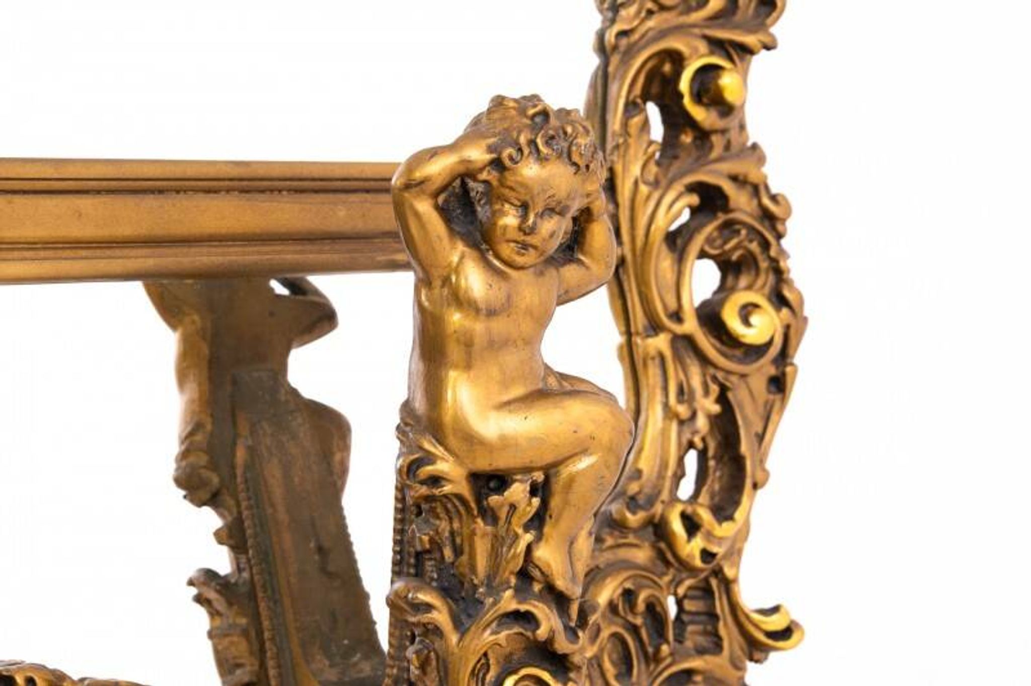 A large mirror in a gold frame, Italy, first half of the 20th century.