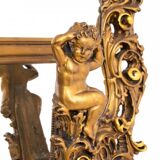 A large mirror in a gold frame, Italy, first half of the 20th century.