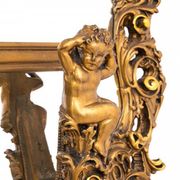 A large mirror in a gold frame, Italy, first half of the 20th century.
