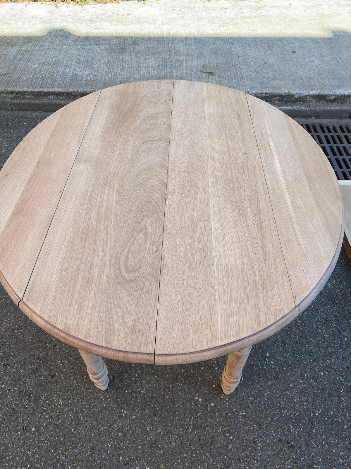 Louis Philippe round extendable dining table with renovated leaves and 4 extensions.