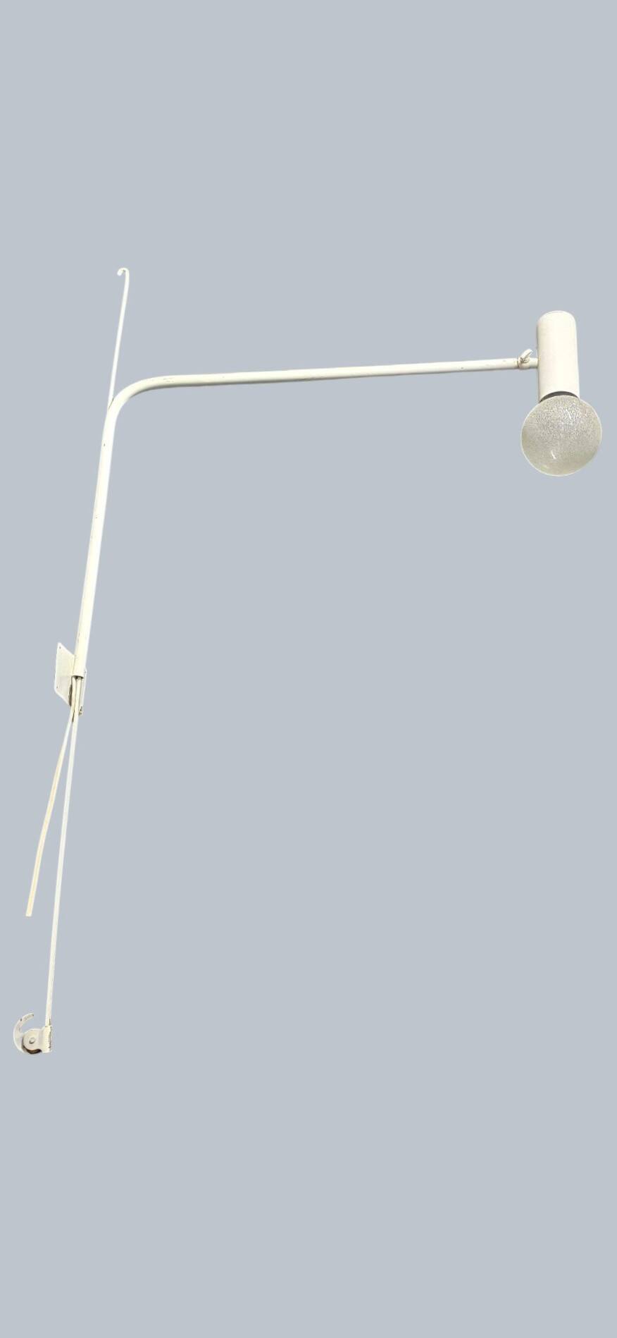 Minimalist metal wall light in the style of Jean Prouvé, circa 1950.